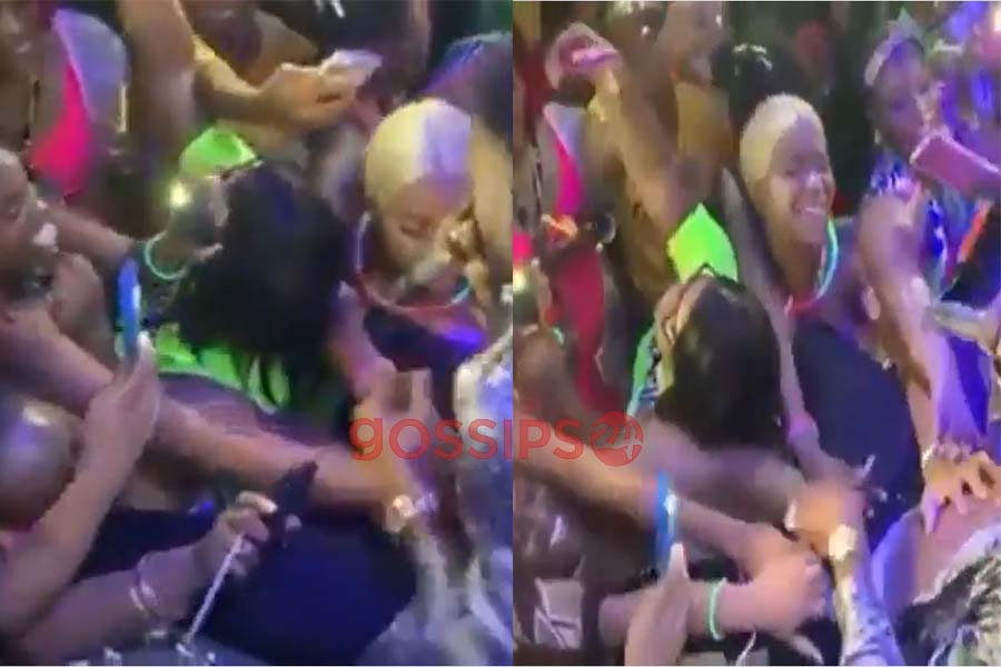 Female fans hold the manhood of male artist on stage